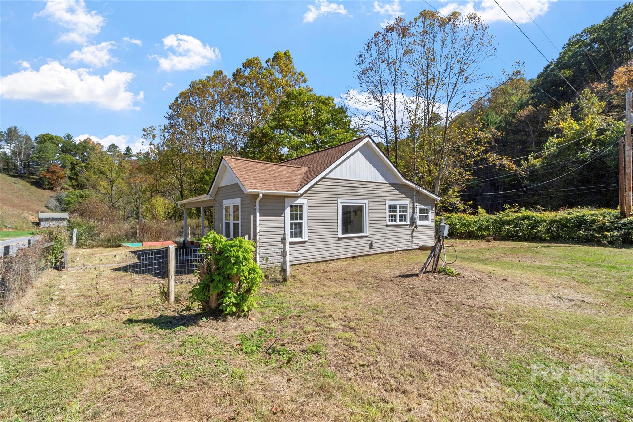 689 Bald Mountain Road Burnsville, NC 28714 - Photo 4 of 21 a view of a house with a yard
