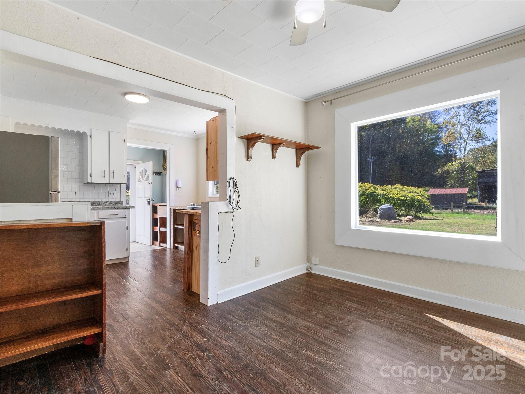 689 Bald Mountain Road Burnsville, NC 28714 - Photo 7 of 21 a view of kitchen with furniture and wooden floor