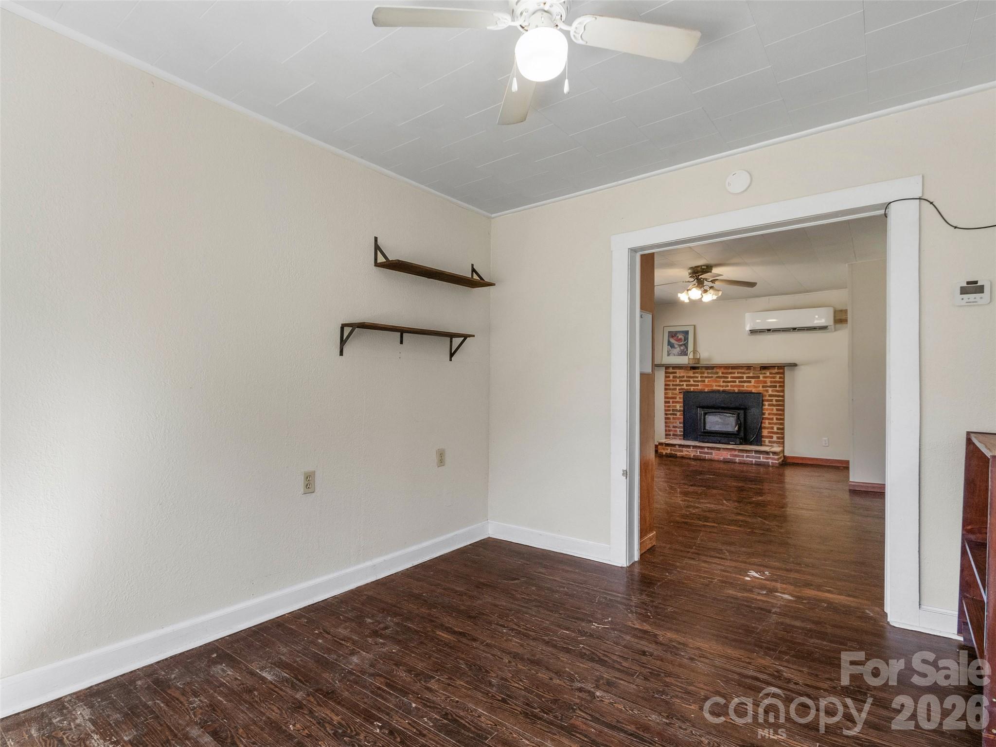 689 Bald Mountain Road Burnsville, NC 28714 - Photo 8 of 21 wooden floor in an empty room