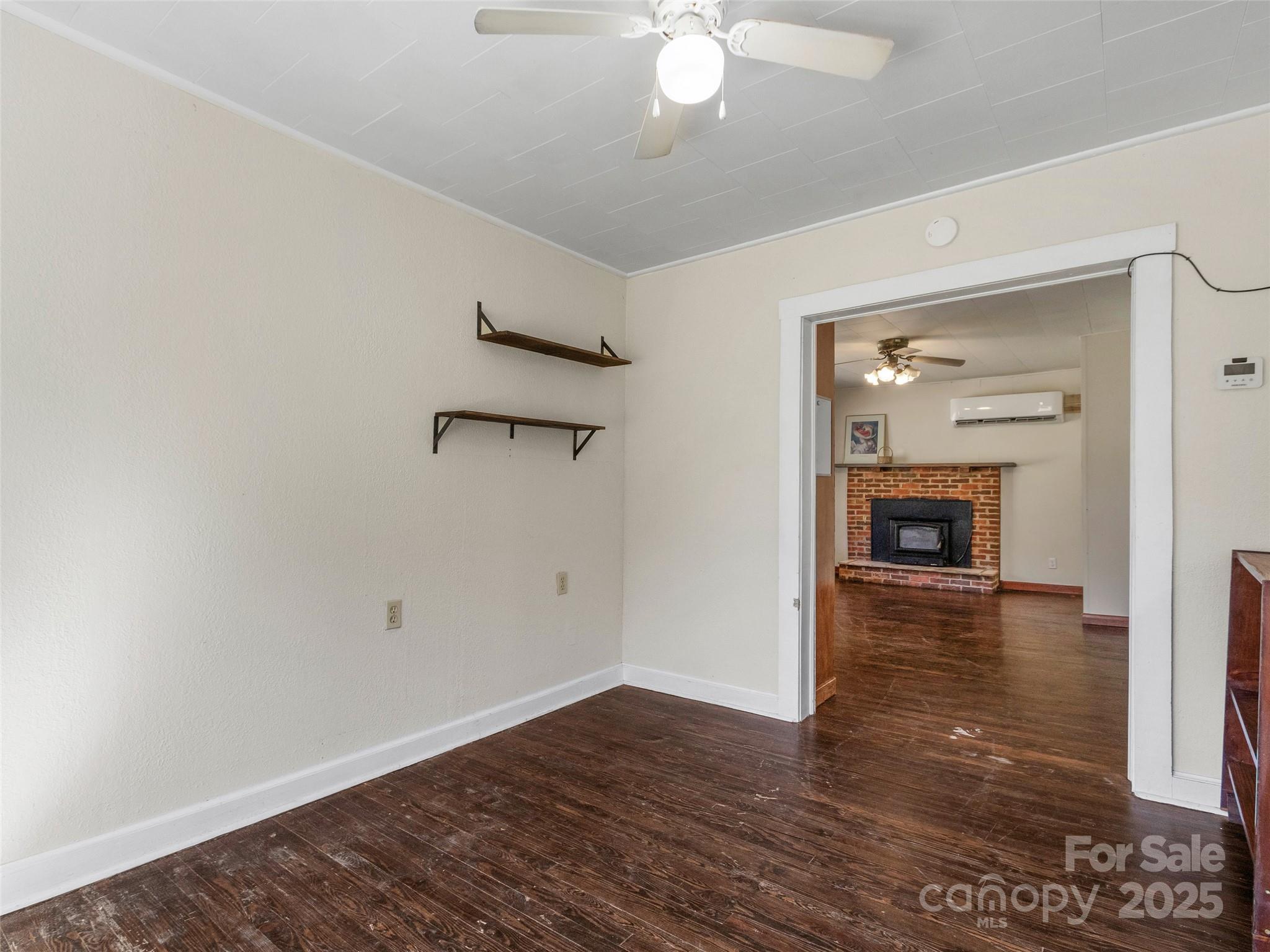 689 Bald Mountain Road Burnsville, NC 28714 - Photo 8 of 21 wooden floor in an empty room