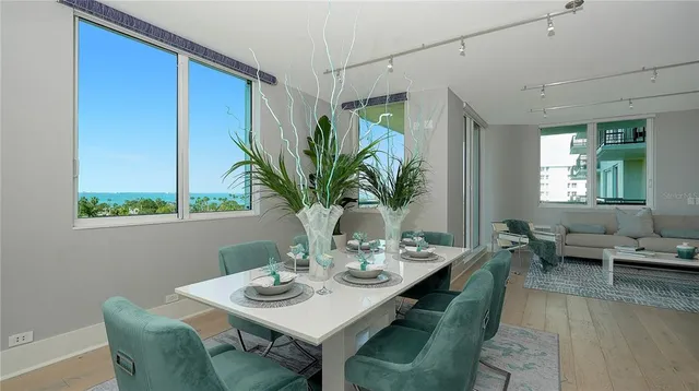 a view of a dining room with furniture window and outside view