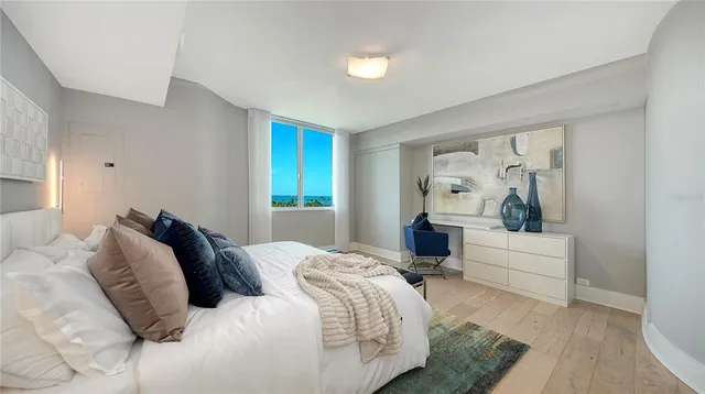 a bedroom with a large bed and a couch