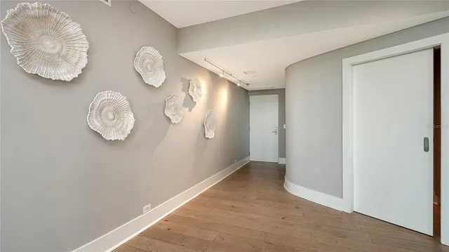 a view of a hallway with a window