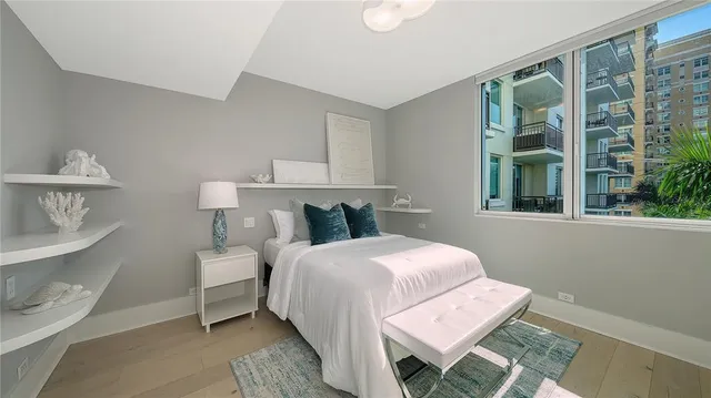 a bed room with a bed and a window