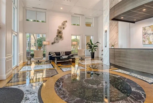 a view of a living room and kitchen