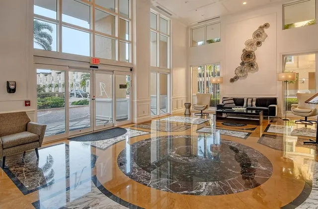 a view of a living room and kitchen floor