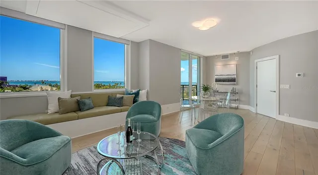 a living room with furniture and a large window