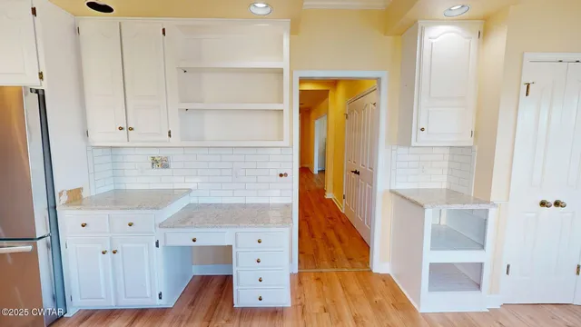 a bathroom with a sink and a mirror with bathtub