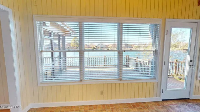 a view of a room that has a bed in it