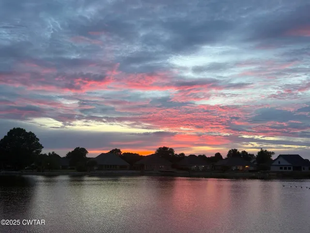 a view of a lake from a balcony