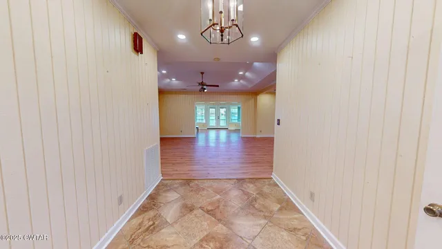 a view of gallery with chandelier