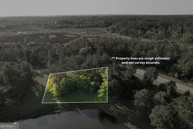 a view of a lake with a yard