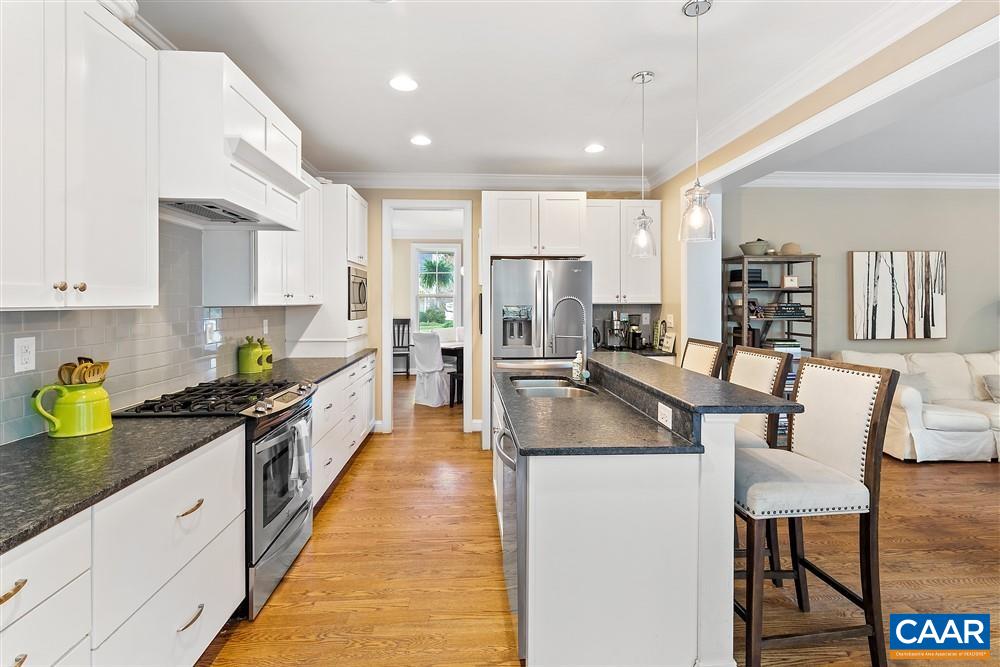 1728 Bending Branch Road Charlottesville, VA 22901 - Photo 11 of 36 a kitchen with stainless steel appliances granite countertop sink stove refrigerator and cabinets