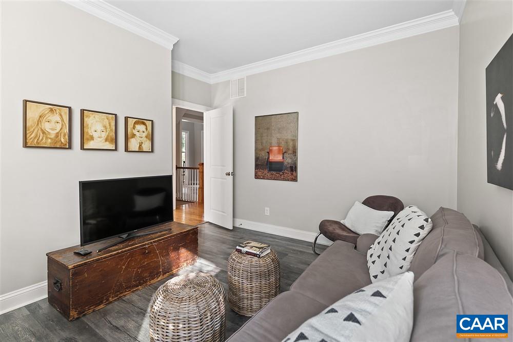 1728 Bending Branch Road Charlottesville, VA 22901 - Photo 18 of 36 a living room with furniture a flat screen tv and a fireplace