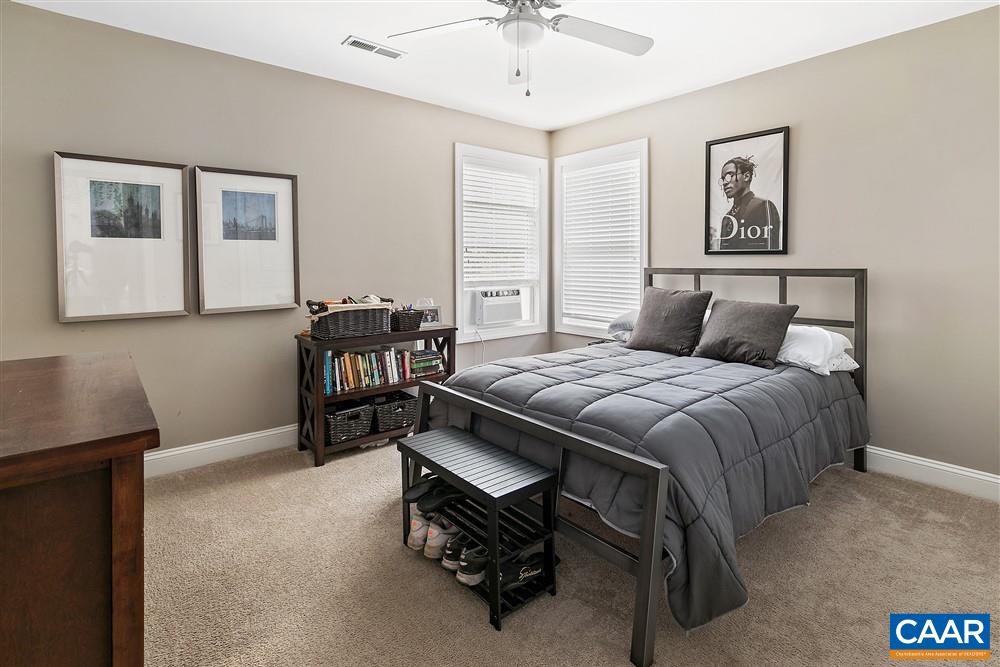 1728 Bending Branch Road Charlottesville, VA 22901 - Photo 26 of 36 a bedroom with a bed and a chandelier