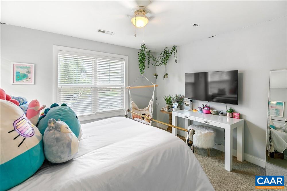 1728 Bending Branch Road Charlottesville, VA 22901 - Photo 28 of 36 a bedroom with a bed and flat screen tv