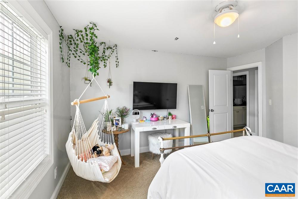 1728 Bending Branch Road Charlottesville, VA 22901 - Photo 29 of 36 a bedroom with a bed and a flat screen tv