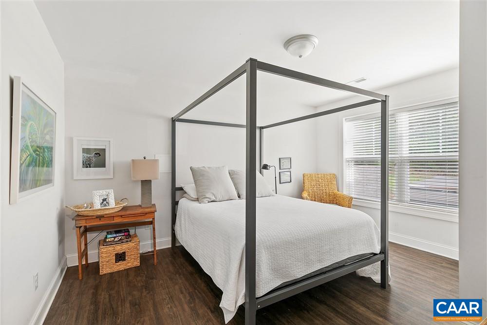 1728 Bending Branch Road Charlottesville, VA 22901 - Photo 33 of 36 a bedroom with a bed and a table