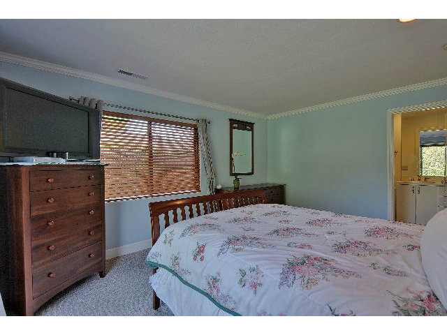 175 Giffin Road Los Altos, CA 94022 - Photo 15 of 22 a bedroom with a bed and a flat screen tv