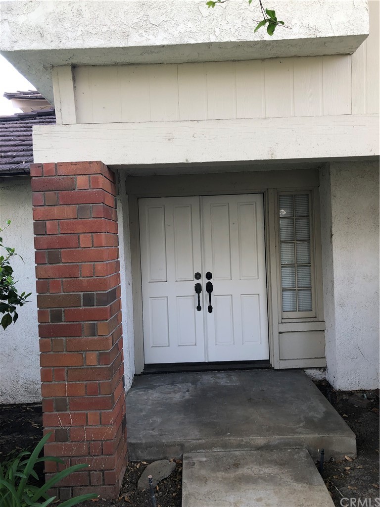 142 West Yale Loop Irvine, CA 92604 - Photo 2 of 28 a front view of a house with a garage