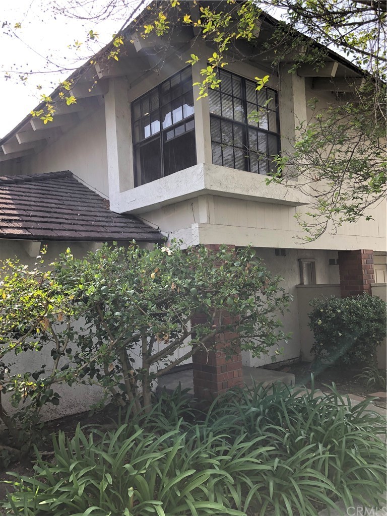 142 West Yale Loop Irvine, CA 92604 - Photo 3 of 28 a front view of a house with a yard