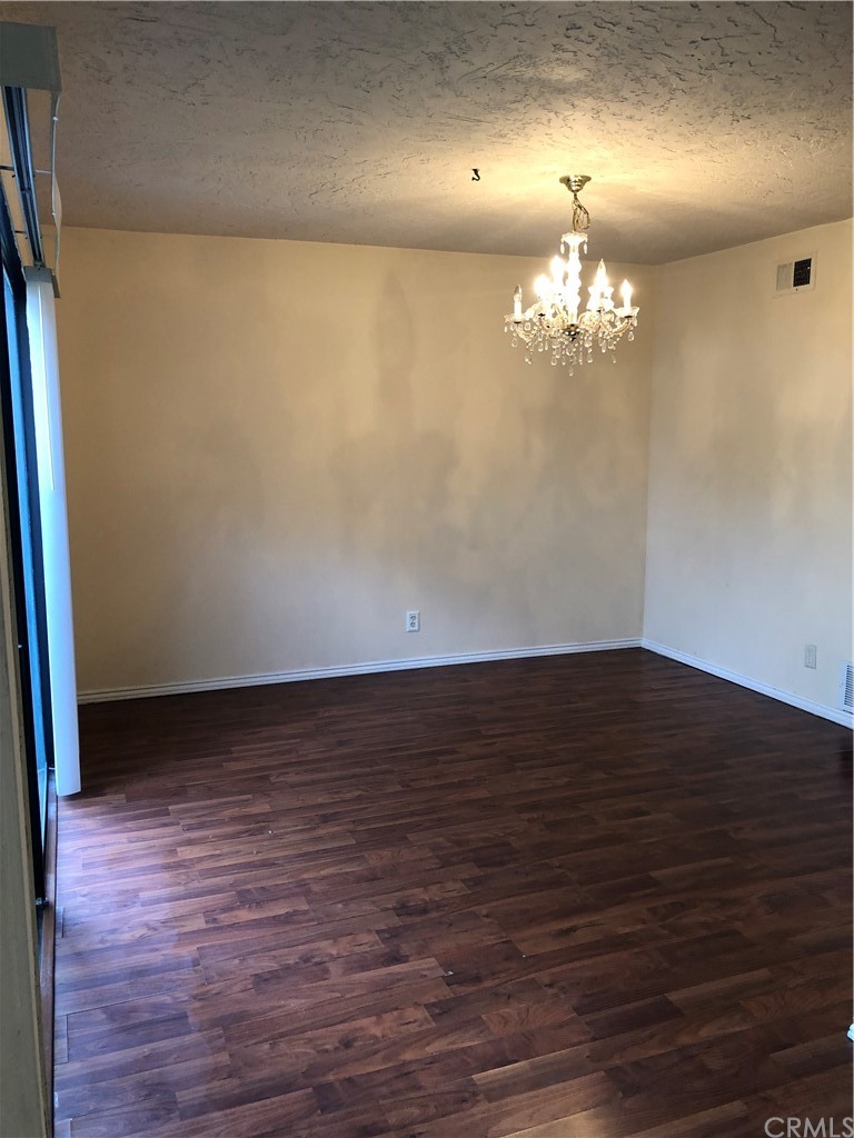 142 West Yale Loop Irvine, CA 92604 - Photo 8 of 28 an empty room with wooden floor