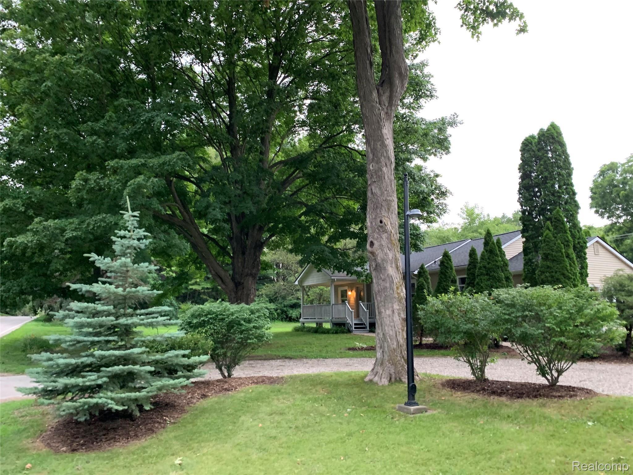 4859 Crooked Lake Road Howell, MI 48843 - Photo 70 of 90 View from Driveway showing circle driveway and beautiful landscaping