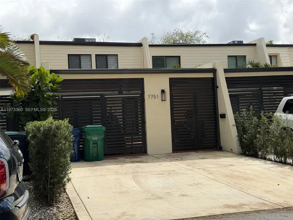a front view of a house with a garage