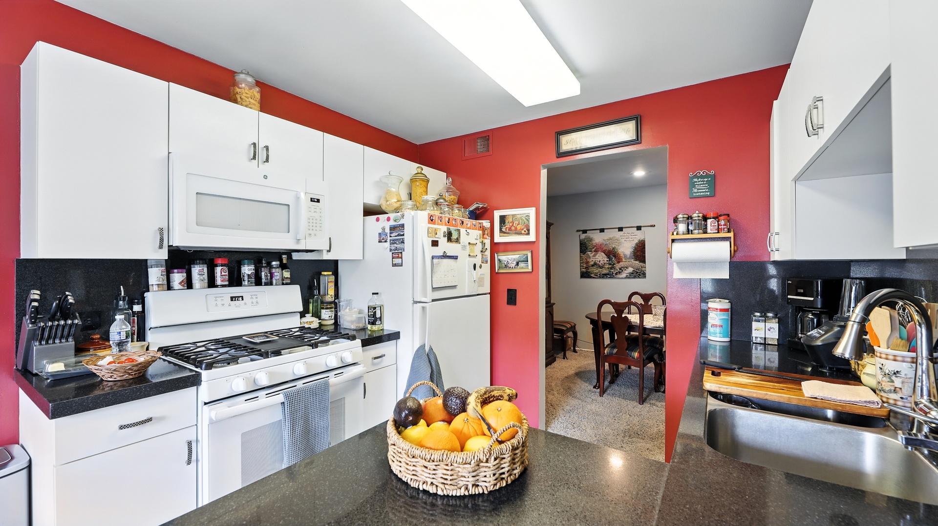 550 Greystone Lane, Unit A2 Wheeling, IL 60090 - Photo 5 of 15 a kitchen with stainless steel appliances kitchen island granite countertop a sink and cabinets