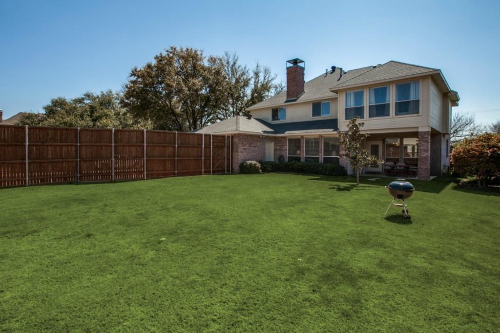 5801 Yeary Road Plano, TX 75093 - Photo 32 of 33 Expansive green lawn with a privacy fence