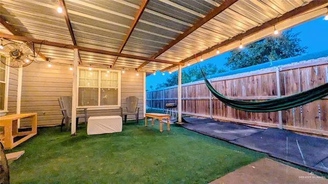 a view of an house with backyard porch and wooden floor