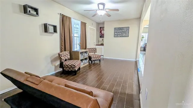 a living room with furniture and a window