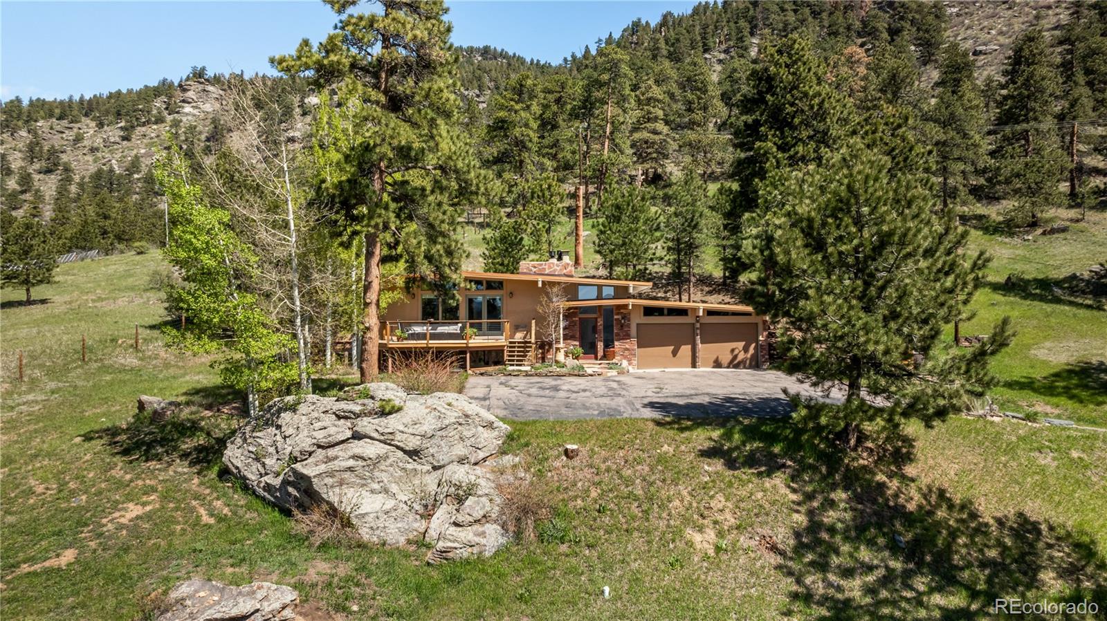 a view of house with yard