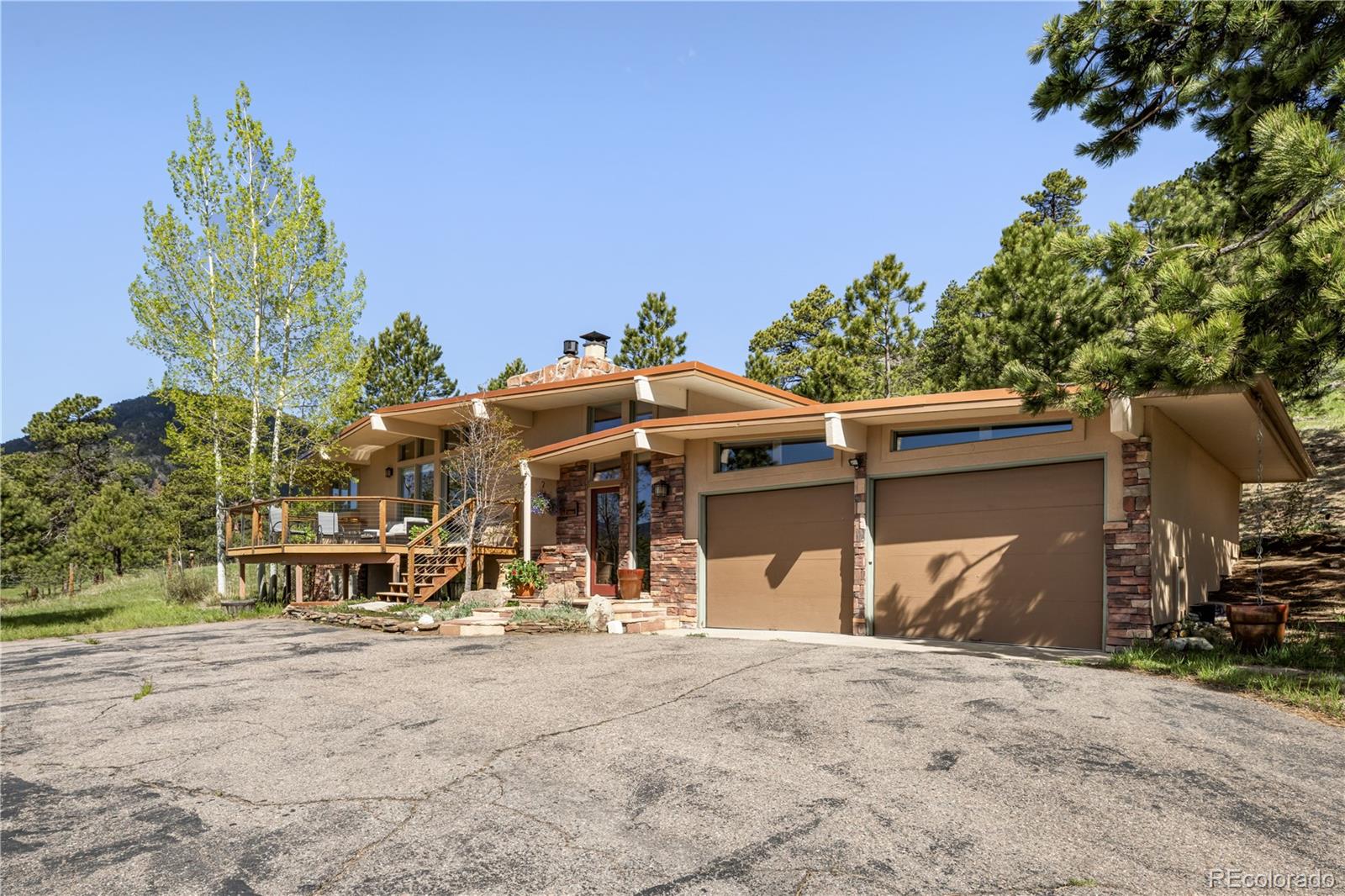 107 Elk Drive Evergreen, CO 80439 - Photo 11 of 45 a view of a house with a outdoor space
