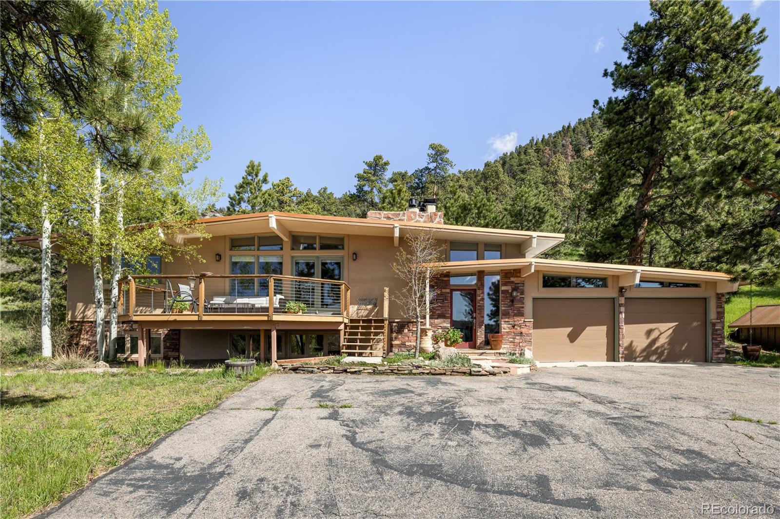 107 Elk Drive Evergreen, CO 80439 - Photo 12 of 45 a view of a house with a yard and sitting area