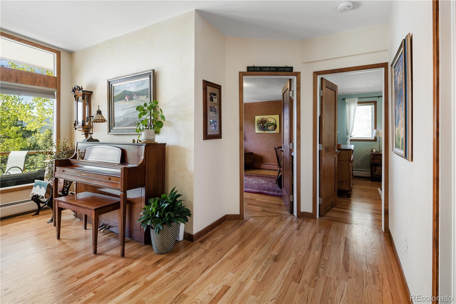 107 Elk Drive Evergreen, CO 80439 - Photo 17 of 45 a living room with furniture and a wooden floor