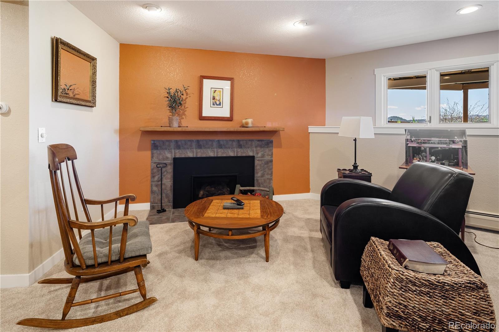 107 Elk Drive Evergreen, CO 80439 - Photo 28 of 45 a living room with furniture and a fireplace