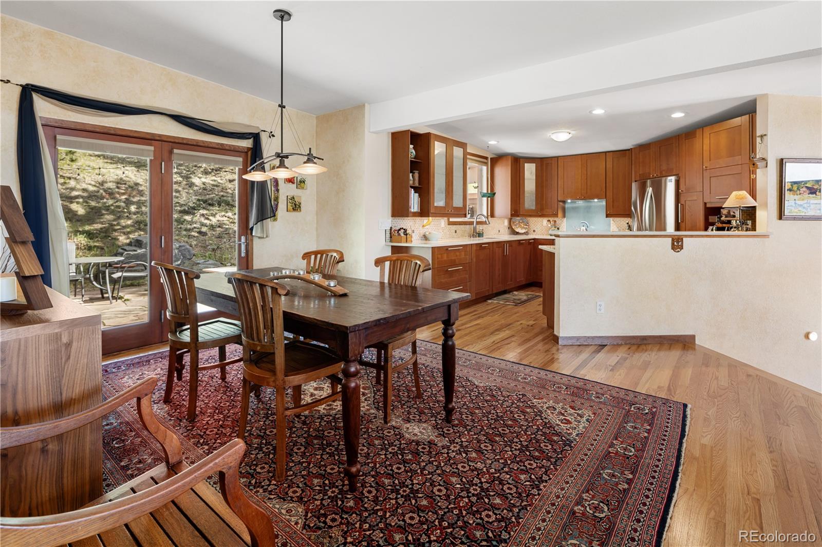 107 Elk Drive Evergreen, CO 80439 - Photo 3 of 45 a view of a dining room with furniture window and wooden floor