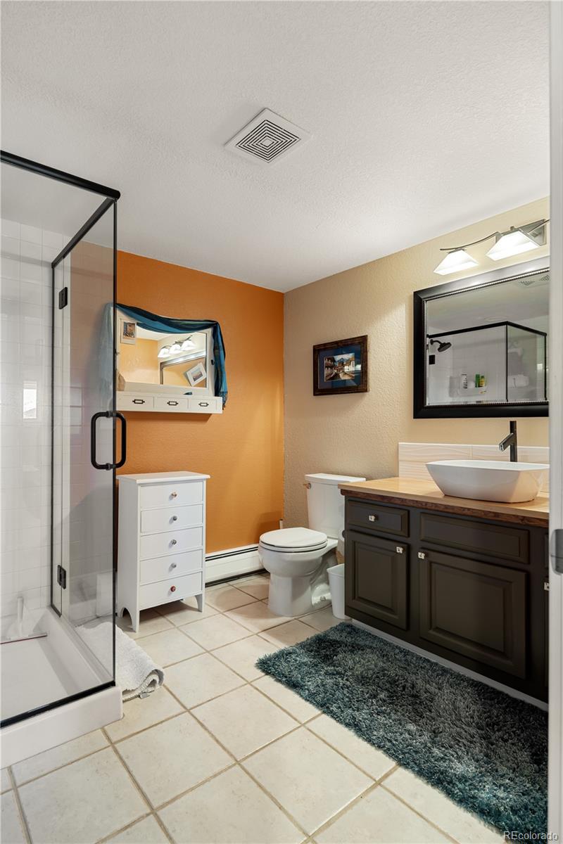 107 Elk Drive Evergreen, CO 80439 - Photo 33 of 45 a bathroom with a toilet sink and mirror