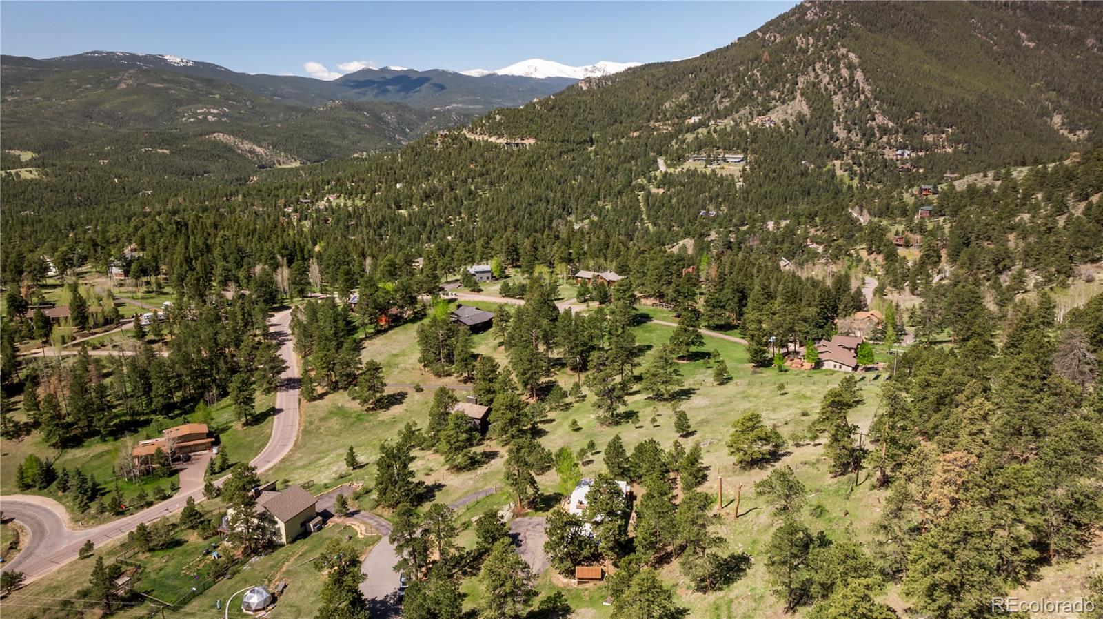 107 Elk Drive Evergreen, CO 80439 - Photo 44 of 45 a view of a city with mountains in the background