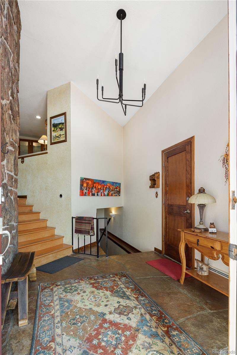 107 Elk Drive Evergreen, CO 80439 - Photo 7 of 45 a living room with furniture and a rug