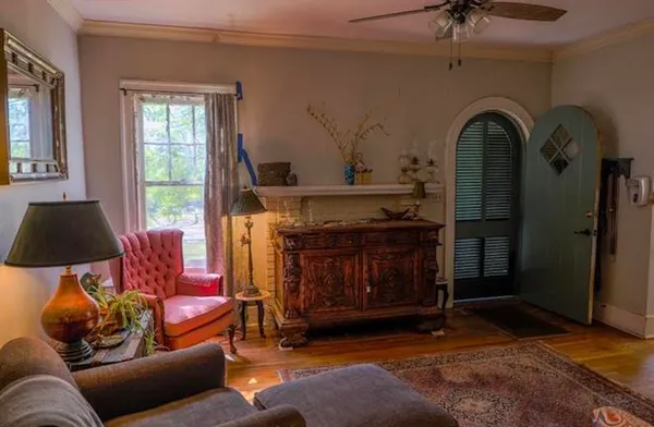 a living room with furniture and a flat screen tv