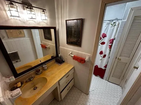 a view of dinning room with wooden floor and windows