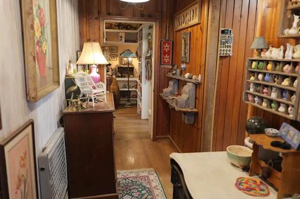 a bed room with a bed and a chandelier