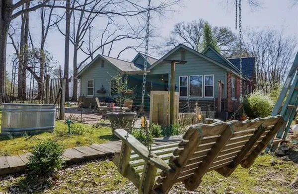 a front view of a house with garden