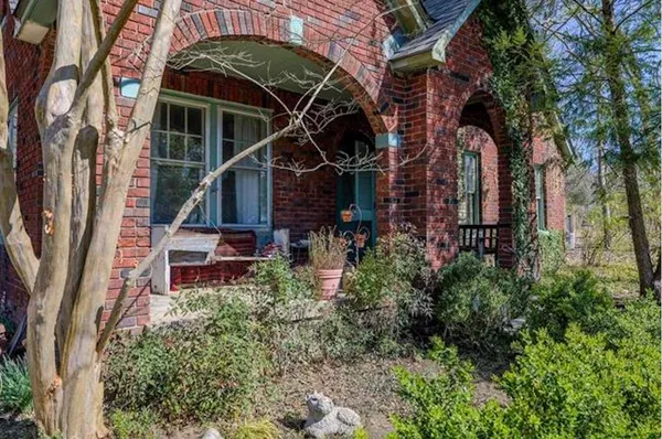 front view of a house with a bench