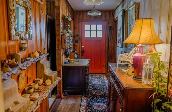 a room that has a bed and a chair in it