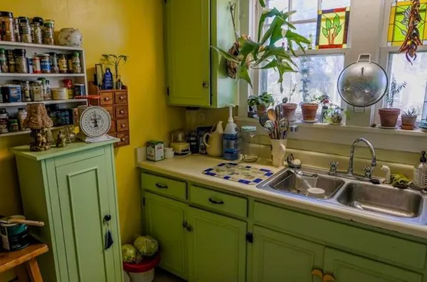a room with cabinets and wooden floor