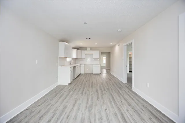 a view of kitchen with wooden floor