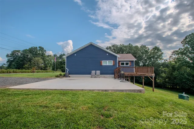 a house view with a sitting space and garden